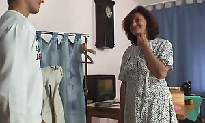 Sewing 80 duration old granny pleases her customer